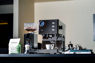 LUCCA Tempo espresso machine close up with a bean hopper on the left and a blue dial gauge