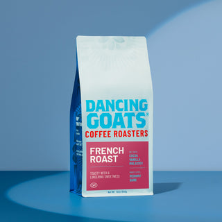 Dancing Goats French Roast coffee bag with pink panel and bold white text advertising tasting notes and roast level.