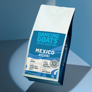 Mexico Sicobi coffee bag tilted on blue background with white label and origin details