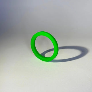 Bright green 8.4 mm silicone group head gasket for Rancilio Silvia shown at angle