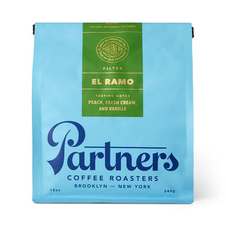 Blue Partners coffee roasters bag labeled El Ramo with tasting notes peach fresh cream and vanilla.