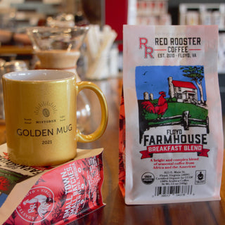 Organic Floyd Farmhouse Breakfast Blend bag shown from the side with farm scene artwork and barcode