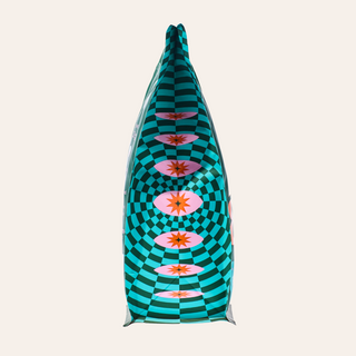 Close-up of a teal patterned Goshen coffee bag with geometric checkered design