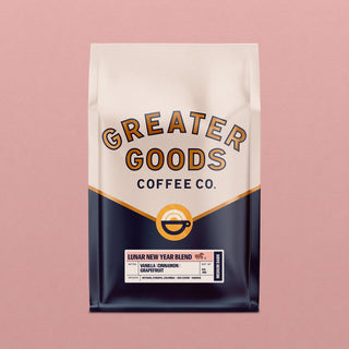 Lunar New Year Blend coffee bag with bottom label detailing notes and origin on cream and navy packaging against pink background