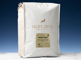 Kaldi's Coffee Fair Trade Organic French Roast bag in white packaging with a gold label.