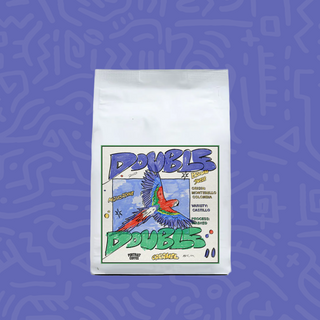 Double Double coffee bag with a colorful parrot label on a purple background.