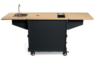 KlassyKarts turn key mobile coffee cart with sink on left circular center hole and wooden prep surface