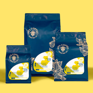Blue PTs Coffee Roasting Co bags against a bright yellow background