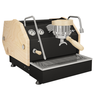 La Marzocco GS3 espresso machine with natural wood side panel and chrome levers on a black body