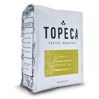 Topeca El Salvador Ayutepeque coffee bag with botanical side wrap and bold TOPECA branding