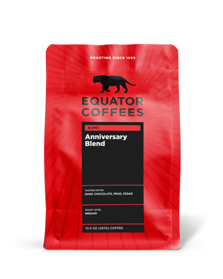 Bright red Equator Coffees Anniversary Blend bag with a black label and tasting notes panel.