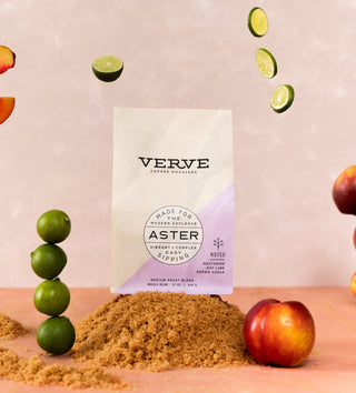 Aster coffee bag against a pink backdrop with floating citrus slices and the Verve logo