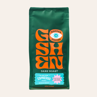 Dark roast Black Dog Espresso bag in deep green with bold orange logo