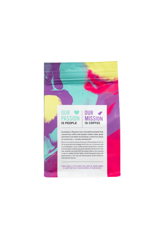 Flores Belas packaging angled to reveal Our Passion is People text and bold colors.