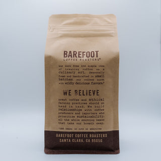 Close up of a brown Barefoot Coffee Roasters Limu bag showing the top fold.