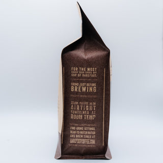 Close-up of the brown coffee bag showing brewing instructions and branding