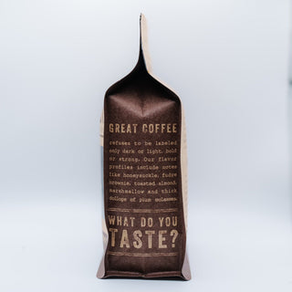 Close up of the Limu bag displaying tasting notes and flavor text on the dark label.