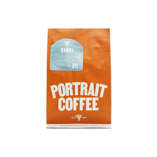Bright orange Portrait Coffee bag labeled BARRY with a light blue tasting notes sticker