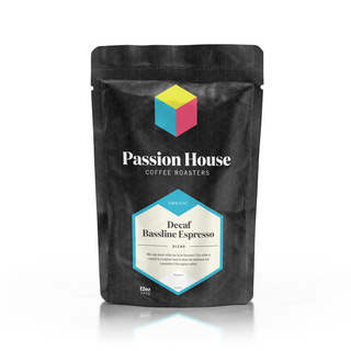 Passion House Coffee Roasters bag featuring Decaf Bassline Espresso Blend label on a black patterned bag with a blue logo cube