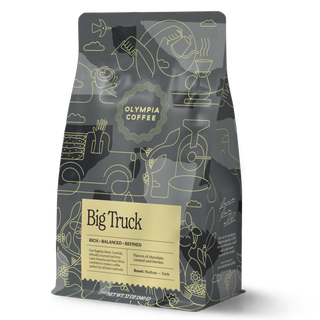 Big Truck coffee bag with yellow label and intricate abstract line art on a dark package