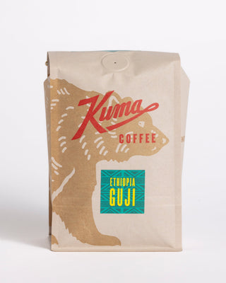Ethiopia Guji coffee bag in kraft packaging with teal Guji label and bold red script across the front