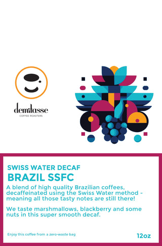 Demitasse Coffee Roasters logo next to a bright abstract fruit illustration on Swiss Water Decaf Brazil 12 oz packaging