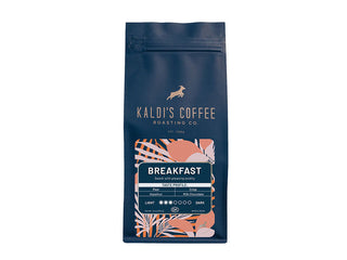 Blue Kaldi's Breakfast Blend bag with bold BREAKFAST label and tropical patterned artwork