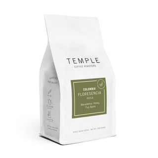 Colombia Floresencia bag close up showing green label with Huila Macadamia Honey Fuji Apple notes