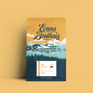 Evans Brothers Chair Six Blend coffee bag with orange landscape artwork and mountains