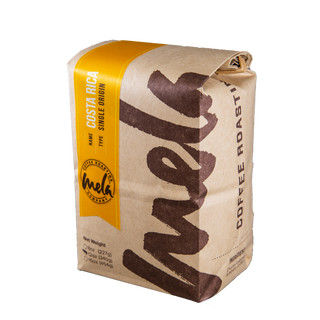Costa Rica Tarrazú coffee bag with bright yellow wrap label and map motif.