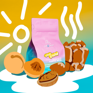 Pink Cafe Vida coffee bag on a bold yellow graphic backdrop with white shapes
