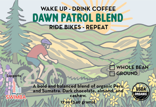 Front label for Dawn Patrol Blend coffee showing a mountain scene with a cyclist and bold Dawn Patrol Blend text