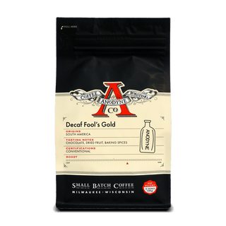 Decaf Fool's Gold coffee bag from Anodyne Coffee Roasting Co with vintage label on a black bag