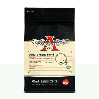 Donut's Friend Blend organic coffee bag from Anodyne Coffee Roasting Co with black top and cream label featuring a red A logo