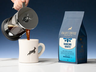 Pouring coffee into a mug beside Kaldi's Dancing Goats Blend bag.