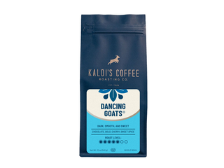 Front view of Kaldi's Coffee Dancing Goats Blend bag with white body and blue label against a white backdrop