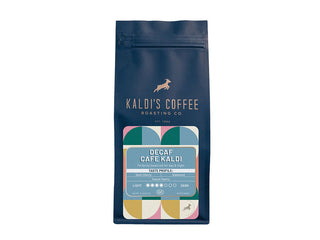 Kaldi's Decaf Cafe Kaldi coffee bag with colorful retro label on a dark blue package