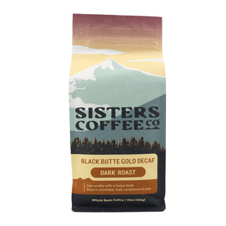 Front view of a Sisters Coffee Co bag labeled Black Butte Gold Decaf dark roast Colombian coffee