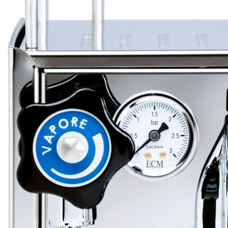 Close-up of the ECM Mechanika Slim PID espresso machine side panel with chrome finish and a visible pressure gauge.
