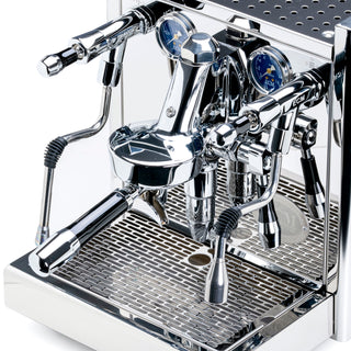Close-up of a polished chrome ECM Technika VI espresso machine with dual group heads blue gauges and portafilter handles