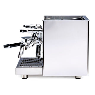 Side view of a chrome ECM Technika VI espresso machine with portafilters attached.