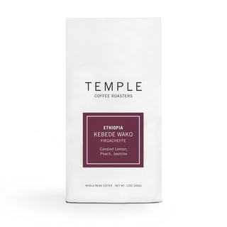 Ethiopia Kebede Wako coffee bag with burgundy label showing Ethiopia Kebede Wako and notes Candied Lemon Peach Jasmine.