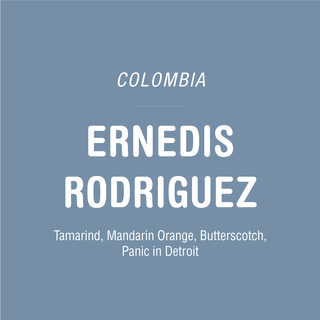 Colombia Ernedis Rodriguez Field Blend coffee cover with bold white text on a blue gray background.