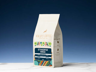 Kaldi's Ethiopia Ardi Natural coffee bag with a bold blue Ardi label and colorful decorative border, angled for display.