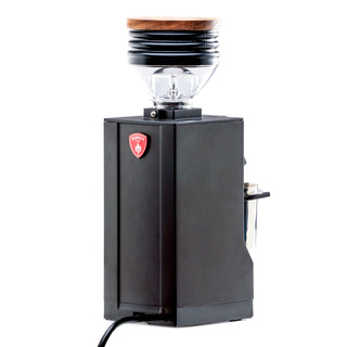 Angled view of Eureka Mignon Zero 65 espresso grinder showing hopper and power cord with red badge on the front
