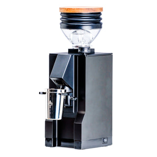 Eureka Mignon Zero 65 espresso grinder with wooden top lid and clear hopper against a white background.