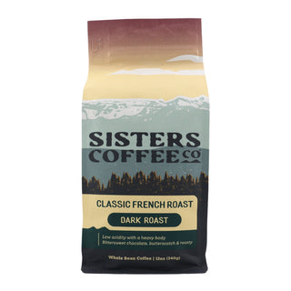 Sisters Coffee Classic French Roast bag with pastel sunset mountains and forest design