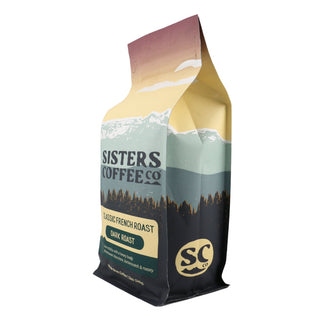 Side view of Sisters Coffee Classic French Roast bag with pastel mountain artwork