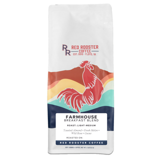 Close up of a white Farmhouse Breakfast Blend bag with Red Rooster logo and rooster graphic.