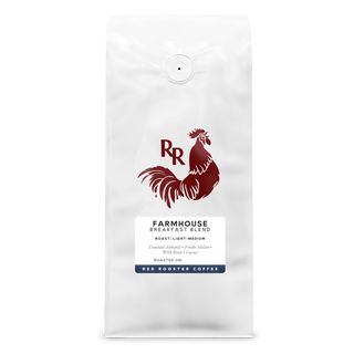 Front view of a white Farmhouse Breakfast Blend coffee bag featuring the Red Rooster rooster logo.